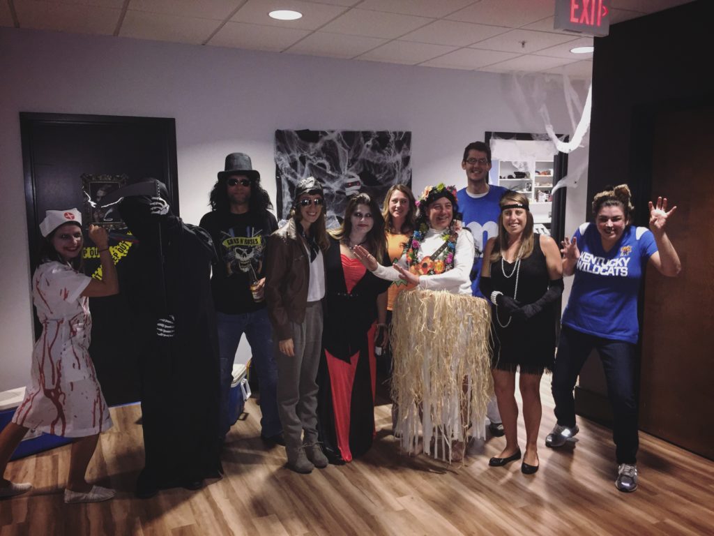 The team celebrates Halloween in their creative costumes