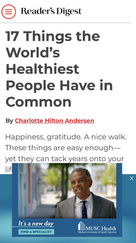 Article title "17 Things the World’s Healthiest People Have in Common" from Reader's Digest by Charlotte Hilton Andersen, discussing habits like happiness and gratitude that contribute to long life, with a medical advertisement overlay at the bottom.